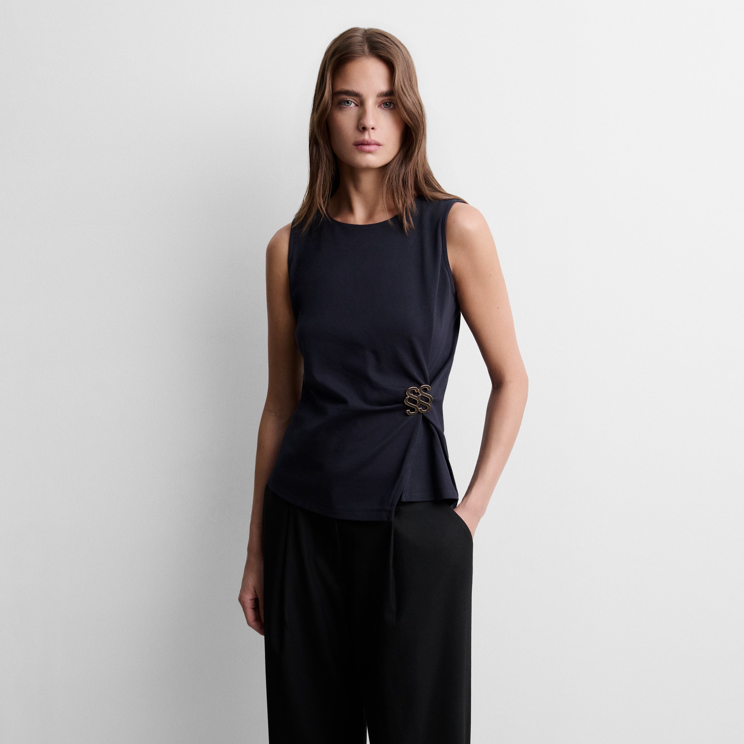 Gathered top with logo brooch