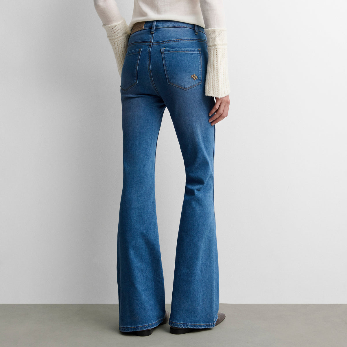 Flared denim trousers