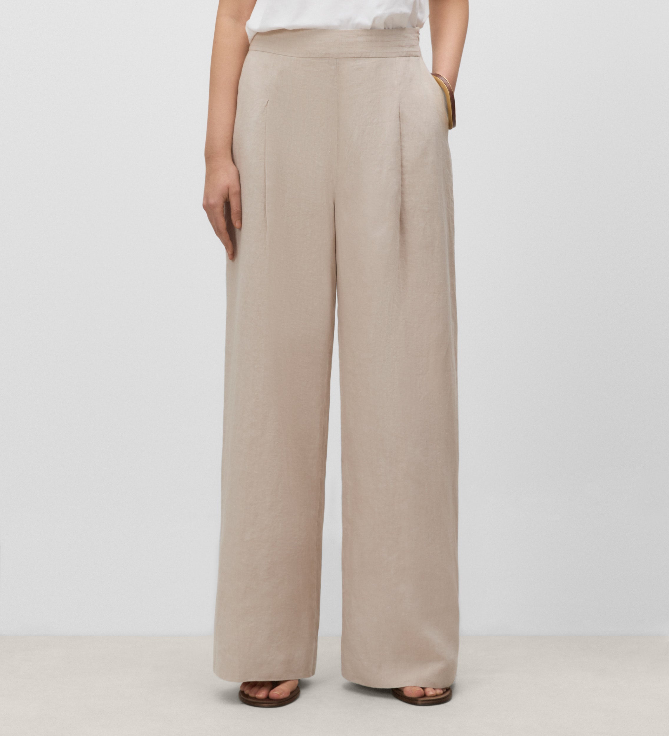 Trousers with stitched waistband