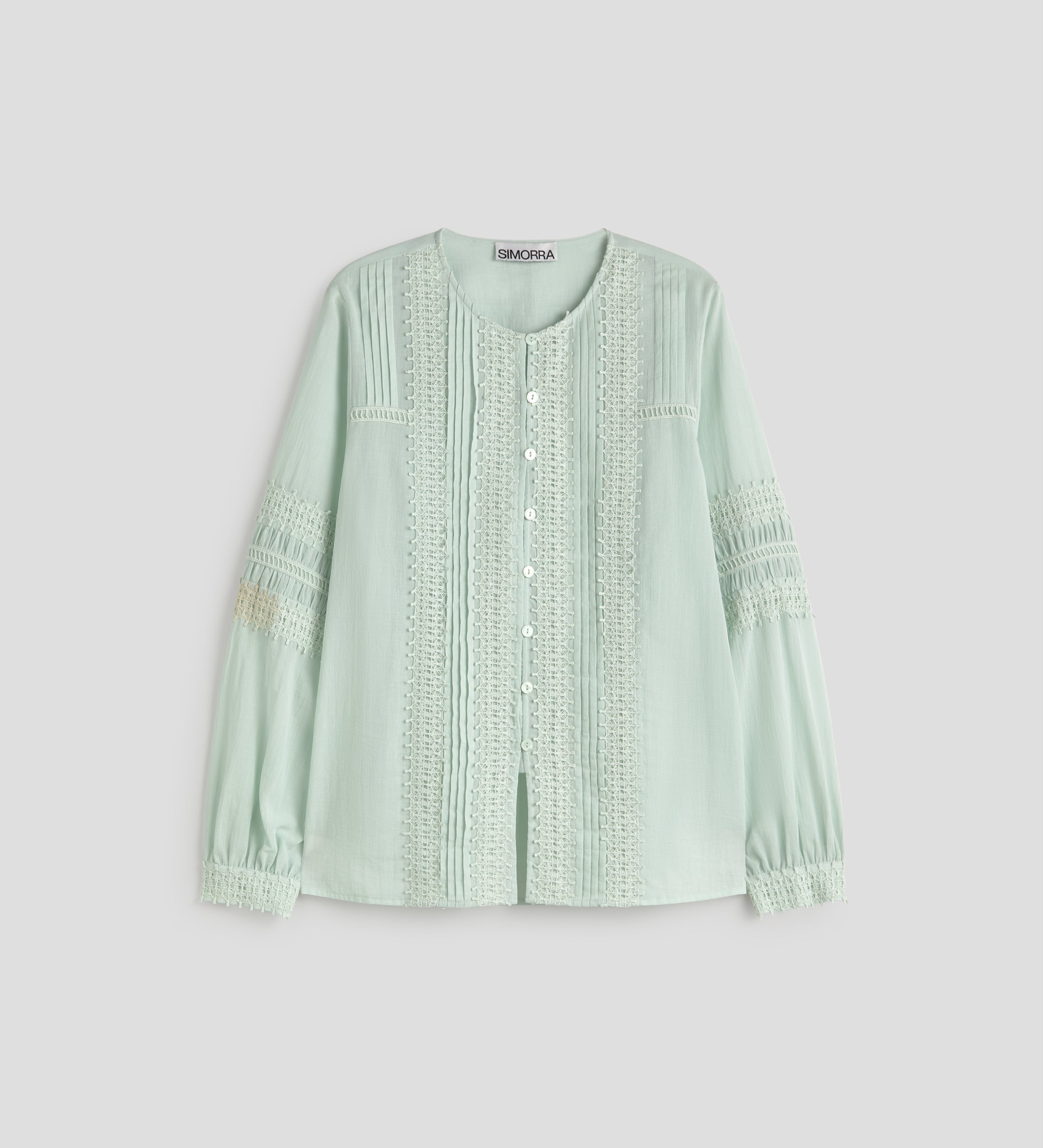 Blouse avec passementeries