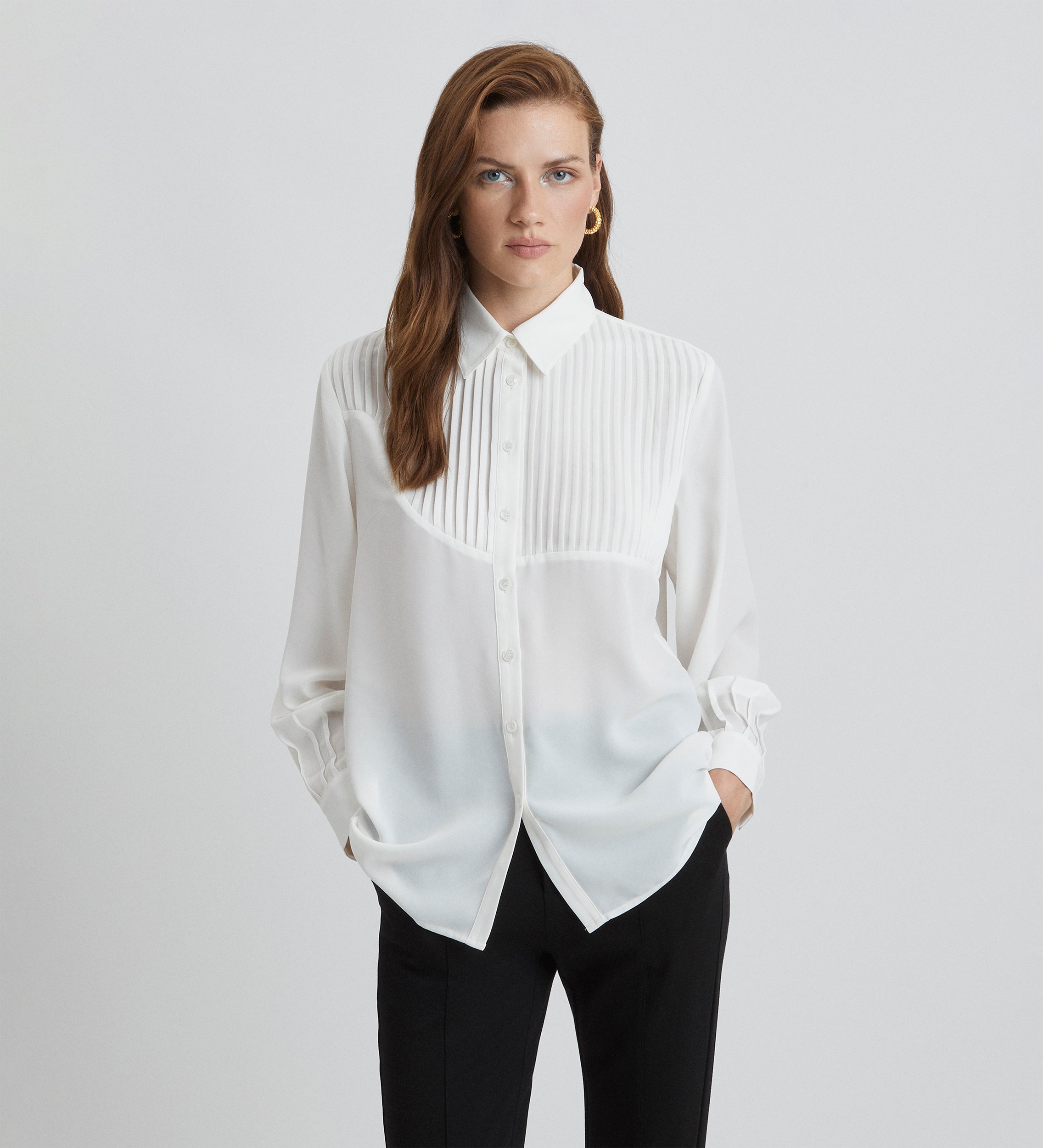 Blouse à lattes à manches bouffantes