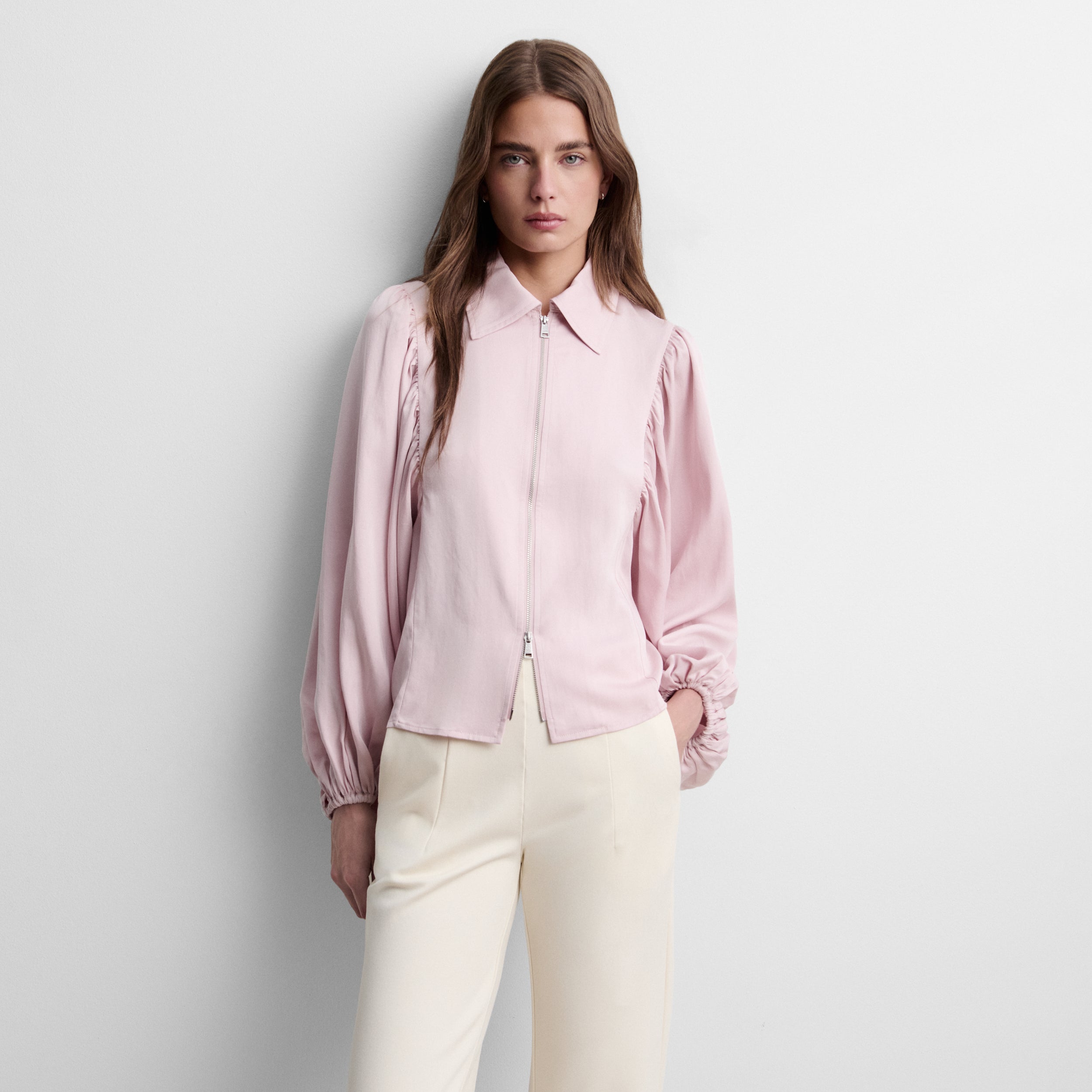 Blouse à fermeture éclair et manches bouffantes