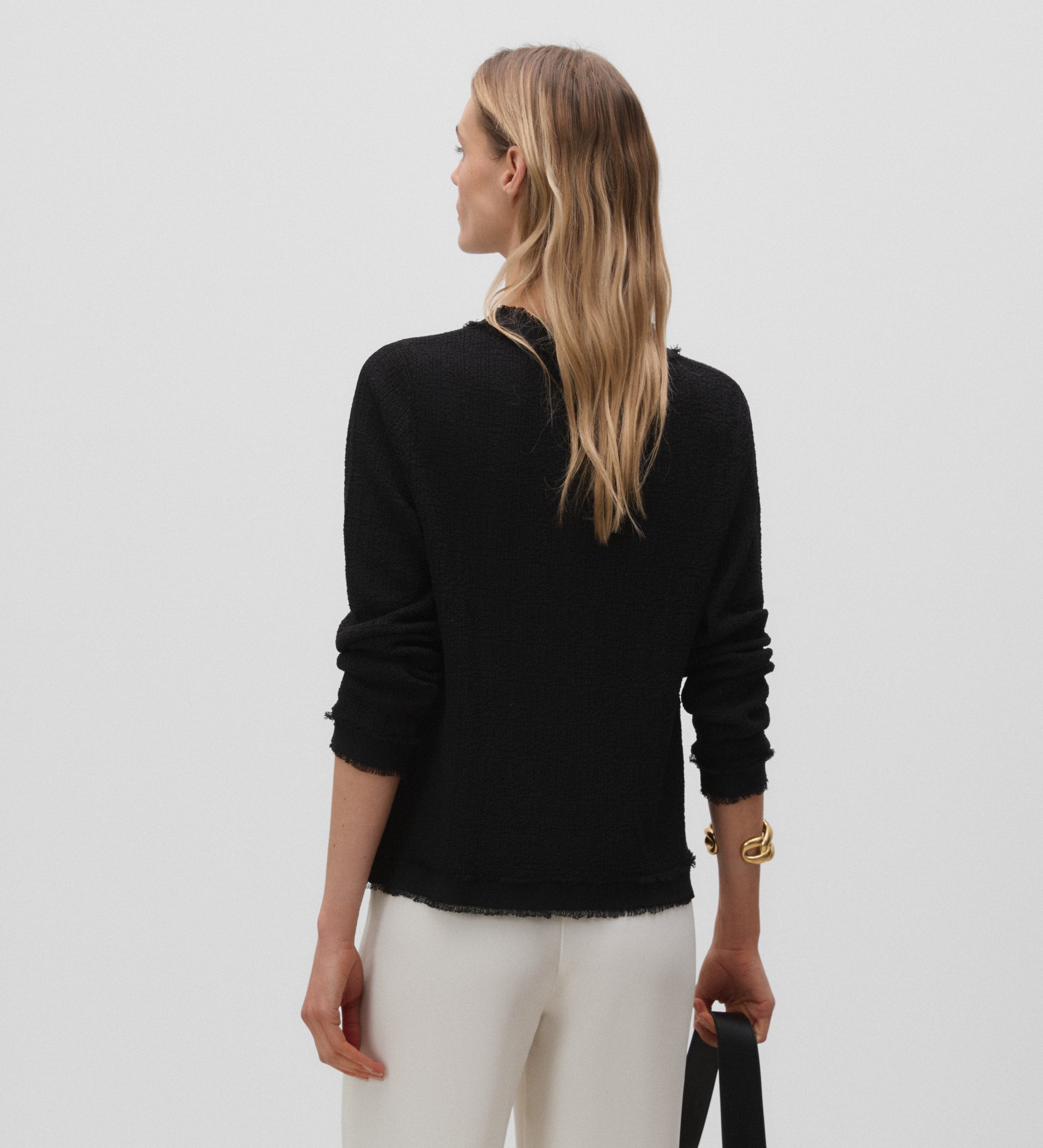 Veste en tricot effiloché