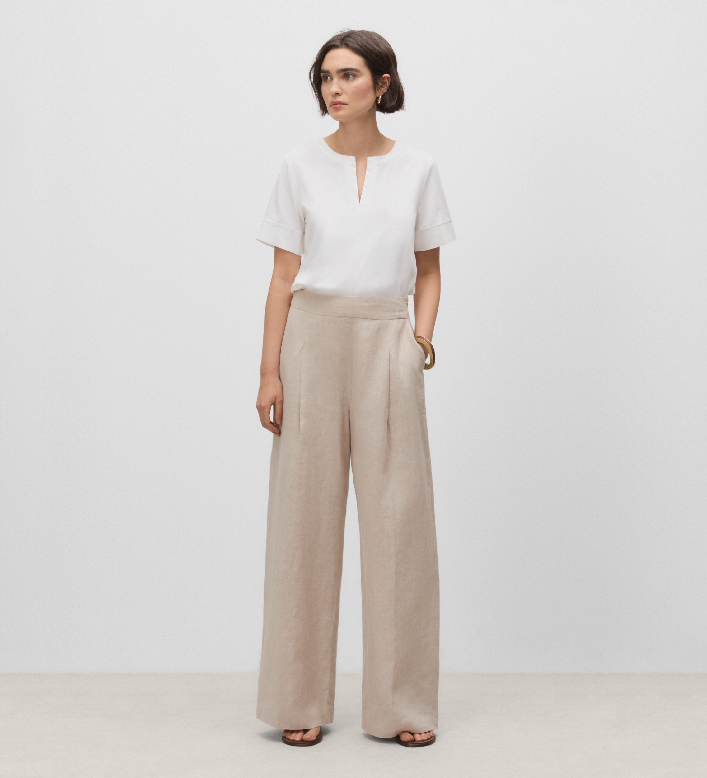 Trousers with stitched waistband