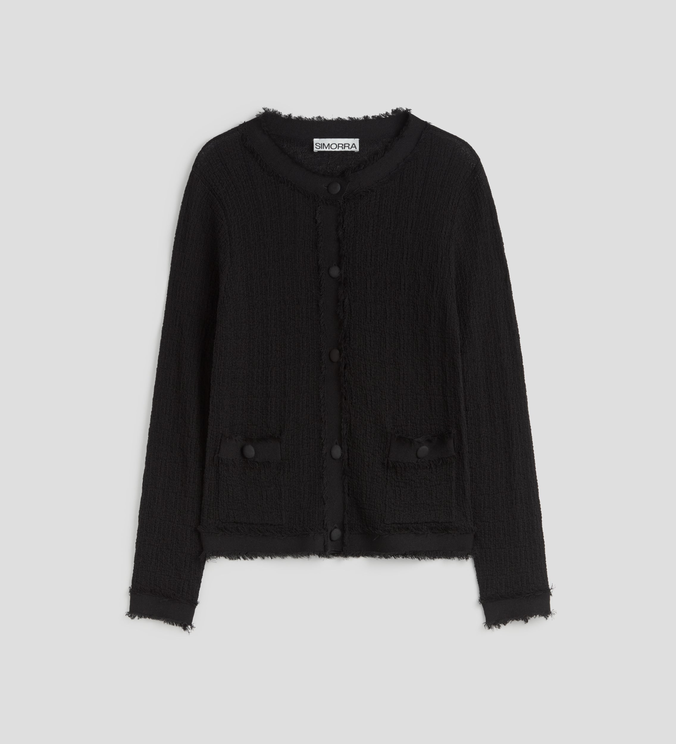 Veste en tricot effiloché
